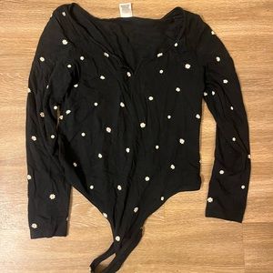 Pink brand daisy body suit.